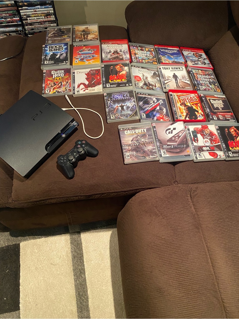 Playstation 3 Slim Console with one controller and 22 Games! (Works Great)